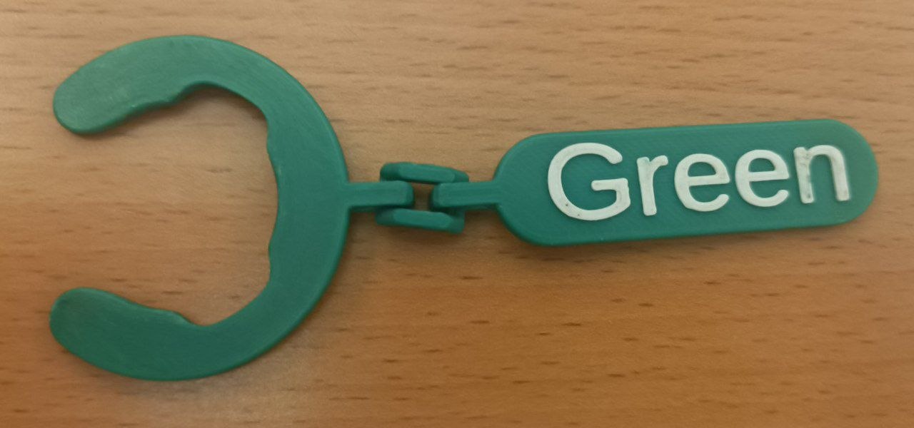 a photo of a green bottle tag